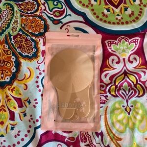 Adhesive stick on bra/nipple covers.